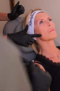 Client receiving mid-face dermal filler treatment at Ashlyns Medispa in Essex from experienced Nurse Prescriber Amy.