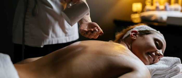 Client enjoying a deep tissue massage treatment at Ashlyns Medispa in Essex to relieve muscle tension and promote wellbeing.